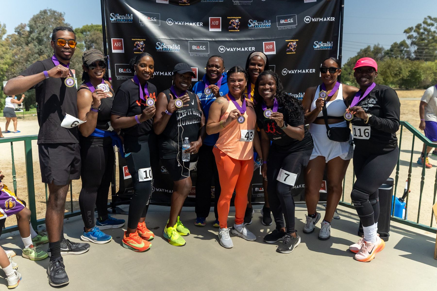 Runners showing off their medals at The Bulldog Run 5K